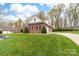 Beautifully landscaped yard and curved driveway at 158 Canopy Oak Ln, Statesville, NC 28625