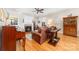 Cozy living room featuring hardwood floors, a fireplace, and comfortable seating at 158 Canopy Oak Ln, Statesville, NC 28625