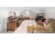 Cozy living room features a plush leather sofa, soft carpeting, neutral decor, and a flat screen television at 158 Canopy Oak Ln, Statesville, NC 28625
