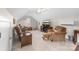 Comfortable living room featuring plush carpeting, vaulted ceiling, comfortable seating, and a flat screen television at 158 Canopy Oak Ln, Statesville, NC 28625