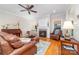 Cozy living room features a fireplace, hardwood floors, and comfortable seating at 158 Canopy Oak Ln, Statesville, NC 28625