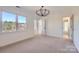 Spacious bedroom with large windows that provide natural light and scenic community views at 18038 Greyfield Gln, Fort Mill, SC 29707