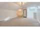 Versatile bonus room with skylights, neutral carpeting, and ample natural light at 18038 Greyfield Gln, Fort Mill, SC 29707
