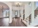 Spacious foyer with gleaming hardwood floors, a grand staircase, and soaring ceilings at 18038 Greyfield Gln, Fort Mill, SC 29707