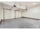Clean, epoxy-floored two-car garage with automatic door openers and plenty of space at 18038 Greyfield Gln, Fort Mill, SC 29707