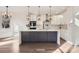 Contemporary kitchen with a large island, stainless steel appliances, and hardwood floors at 18038 Greyfield Gln, Fort Mill, SC 29707