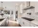 Modern kitchen features white cabinets, stainless steel appliances, and marble backsplash at 18038 Greyfield Gln, Fort Mill, SC 29707