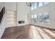Bright living room with fireplace, built-in shelving, and large windows at 18038 Greyfield Gln, Fort Mill, SC 29707