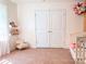 Cozy bedroom shows natural light, soft chair, and plush carpet, creating a warm and inviting space at 1814 Woods Ln, Denver, NC 28037
