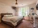 Charming bedroom features a cozy bed, soft lighting, and natural light perfect for a or guest at 1814 Woods Ln, Denver, NC 28037