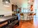Open dining area with a dark wooden table and a view of the kitchen with bar stool seating at 1814 Woods Ln, Denver, NC 28037