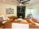 Bright living room featuring a dark fireplace, wooden floors, and stylish decor at 1814 Woods Ln, Denver, NC 28037