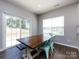 Bright dining area with sliding glass doors leading to the backyard and seating for four at 2018 Sewall Sw Ave, Concord, NC 28025