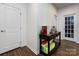Entryway with wood floors and hall table with decorations at 2018 Sewall Sw Ave, Concord, NC 28025