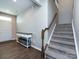 Entryway featuring hardwood floors, staircase with carpeted steps, and a decorative console table at 2018 Sewall Sw Ave, Concord, NC 28025