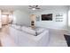 Cozy living room with a large sectional sofa and modern entertainment center at 2018 Sewall Sw Ave, Concord, NC 28025