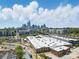 A picturesque aerial view showcasing city buildings, foliage, and a mix of commercial and residential developments at 224 Parkwood Ave, Charlotte, NC 28206