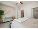 Comfortable bedroom featuring a sitting area and a walk-in closet, offering a private and relaxing space at 224 Parkwood Ave, Charlotte, NC 28206