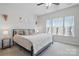 Bright bedroom features plush carpeting, ceiling fan, and a large window for natural light at 224 Parkwood Ave, Charlotte, NC 28206