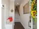 Inviting entryway featuring coat rack, bench, and staircase at 224 Parkwood Ave, Charlotte, NC 28206