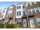 Attractive multi-story townhome with brick and white siding accents at 224 Parkwood Ave, Charlotte, NC 28206