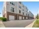 A row of townhomes with brick facades and neat landscaping, offering an appealing curb presence at 224 Parkwood Ave, Charlotte, NC 28206