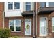 Charming brick townhouse exterior with a welcoming front door at 224 Parkwood Ave, Charlotte, NC 28206