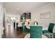 Open-concept kitchen and dining area with island seating and elegant dining set at 224 Parkwood Ave, Charlotte, NC 28206