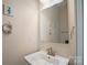 Nautical themed half bath with charming decor and modern fixtures at 224 Parkwood Ave, Charlotte, NC 28206