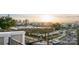 A neighborhood view with rooftops and cityscape merging in a harmonious skyline during sunset at 224 Parkwood Ave, Charlotte, NC 28206