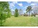 Picture of large, grassy backyard, with a view of a house in the background at 2408 Joes Lake Rd, Shelby, NC 28152
