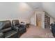 Upstairs bonus room with two recliners, providing an additional living space for relaxation and entertainment at 2408 Joes Lake Rd, Shelby, NC 28152