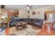 Inviting living room showcasing hardwood floors, ceiling fan, and a comfortable seating arrangement with a floral rug at 2408 Joes Lake Rd, Shelby, NC 28152