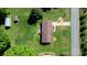 Aerial view of the home showcasing a well-maintained lawn and fenced-in backyard with a detached garage at 2430 Rocky Ford Rd, Newton, NC 28658