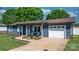 Charming single-story home featuring a blue exterior, a well-manicured lawn, and a cozy front porch at 2430 Rocky Ford Rd, Newton, NC 28658