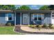 Inviting front porch with rocking chairs and fresh landscaping enhances the curb appeal of this lovely home at 2430 Rocky Ford Rd, Newton, NC 28658