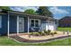 Charming home featuring rocking chairs on the cozy front porch and an attached one car garage at 2430 Rocky Ford Rd, Newton, NC 28658