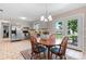 Eat-in kitchen featuring modern appliances, bright light fixture, and backyard access at 2430 Rocky Ford Rd, Newton, NC 28658
