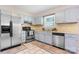 Bright kitchen featuring ample cabinetry, modern appliances, and tiled flooring at 2430 Rocky Ford Rd, Newton, NC 28658