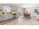 Open eat-in kitchen with tiled floors, modern appliances, and access to the backyard at 2430 Rocky Ford Rd, Newton, NC 28658