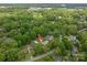 Aerial view showcases the house nestled among mature trees and lush landscape at 2515 Sheffield Dr, Gastonia, NC 28054