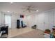 Spacious basement with tile and carpet flooring, a ceiling fan, and white walls and cabinets at 2515 Sheffield Dr, Gastonia, NC 28054