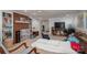 Finished basement with red brick feature wall and fireplace, plus a ceiling fan and a television at 2515 Sheffield Dr, Gastonia, NC 28054