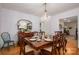 Formal dining room features wood floors, chandelier, and classic furnishings for elegant entertaining at 2515 Sheffield Dr, Gastonia, NC 28054