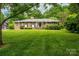 Charming brick home with well-manicured lawn and mature landscaping providing great curb appeal at 2515 Sheffield Dr, Gastonia, NC 28054