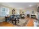 Comfortable living room with bright windows, hardwood floors, and charming interior decor at 2515 Sheffield Dr, Gastonia, NC 28054