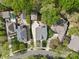 Aerial view of three residences with driveways and a mature tree canopy in the neighborhood at 2569 Lower Assembly Dr, Fort Mill, SC 29708
