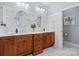 Bathroom with double sink vanity, framed mirrors, sconces and marble floors at 2569 Lower Assembly Dr, Fort Mill, SC 29708