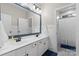 Elegant bathroom features double sink vanity, framed mirror, and shower with tile flooring at 2569 Lower Assembly Dr, Fort Mill, SC 29708