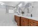 Bathroom with double sink vanity, framed mirrors, sconces and marble floors at 2569 Lower Assembly Dr, Fort Mill, SC 29708